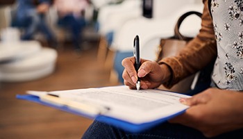 Patient filling out form in lobby
