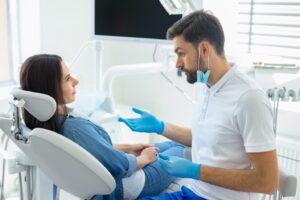 Dentist talking to his patient.